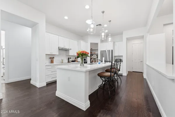 a kitchen with stainless steel appliances and wooden cabinets