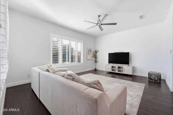 a spacious bathroom with a double vanity sink mirror and bathtub