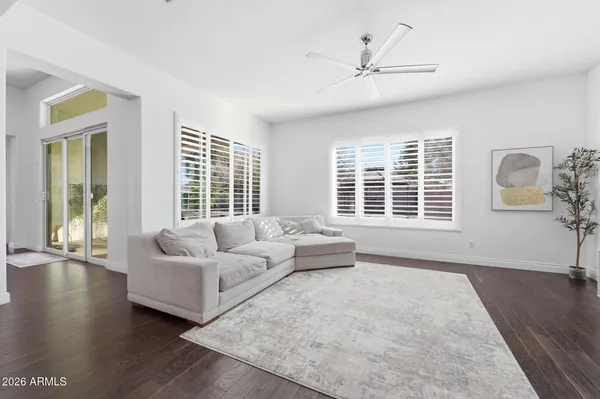 a bathroom with a tub sink shower and mirror