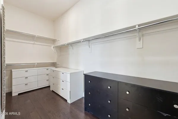 a bedroom with a couch and a baby crib