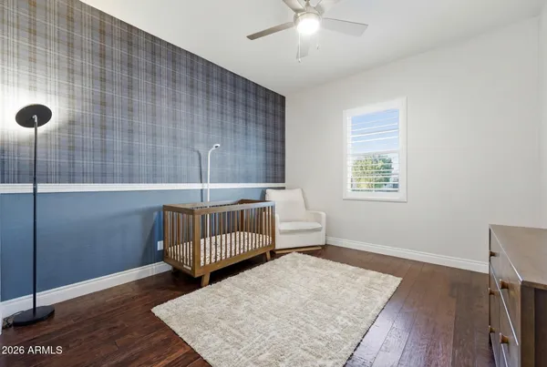 a view of a chairs and table in backyard