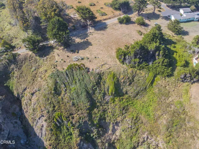 an aerial view of mountain with beach
