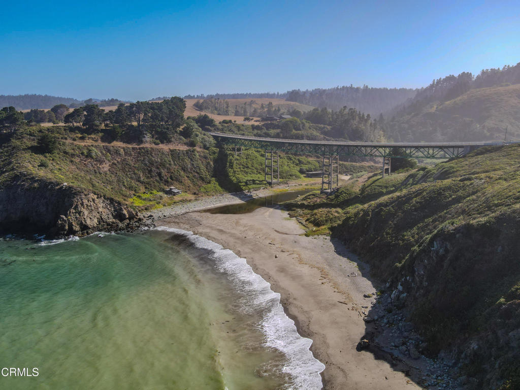 34100 Pacific Reefs Road Albion, CA 95410 - Photo 17 of 20 a view of a lake with mountains in the background