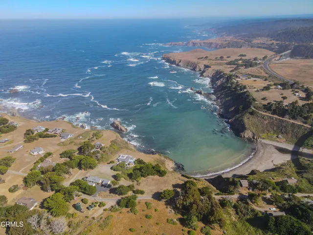 an aerial view of mountain with beach