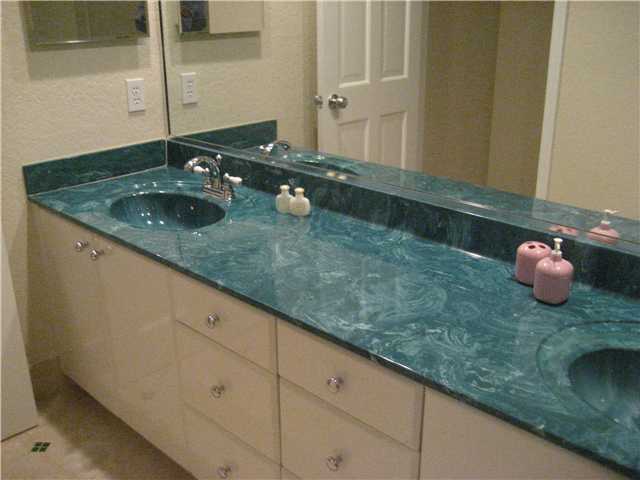 20694 Northwest 27th Terrace Boca Raton, FL 33434 - Photo 19 of 25 a bathroom with a granite countertop sink and a mirror