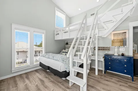 a spacious bedroom with a bed and a window