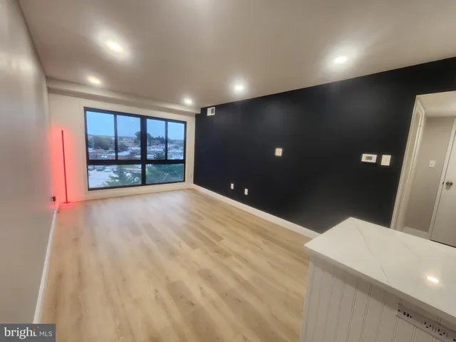 a view of an empty room with windows