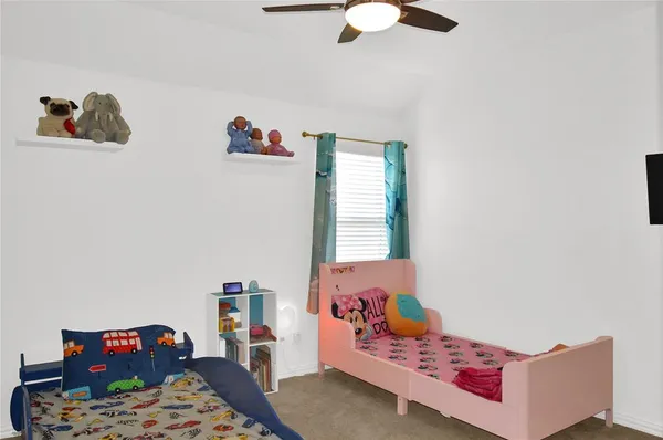 a bedroom with furniture and a window