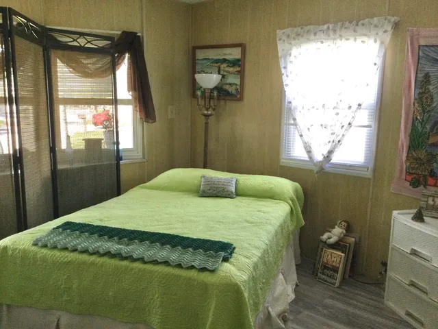 a bathroom with a toilet and a shower curtain