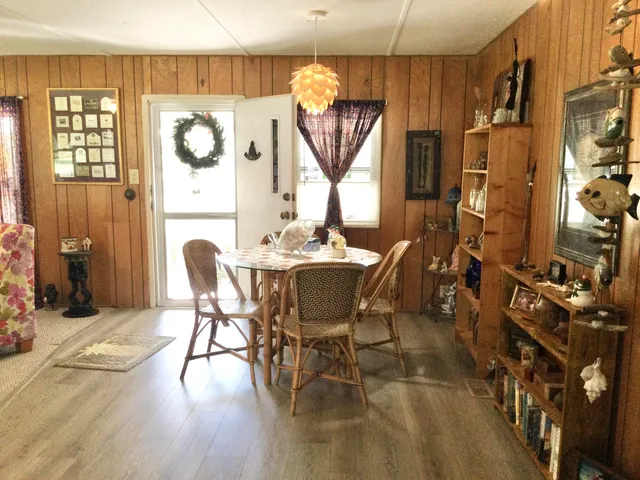 a dining room with furniture and window