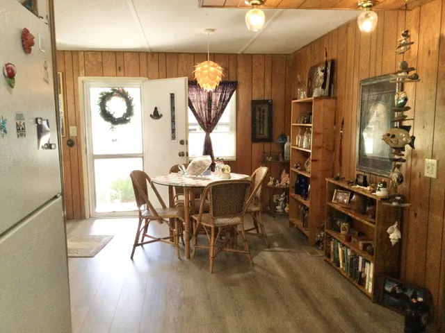a dining room with furniture and window