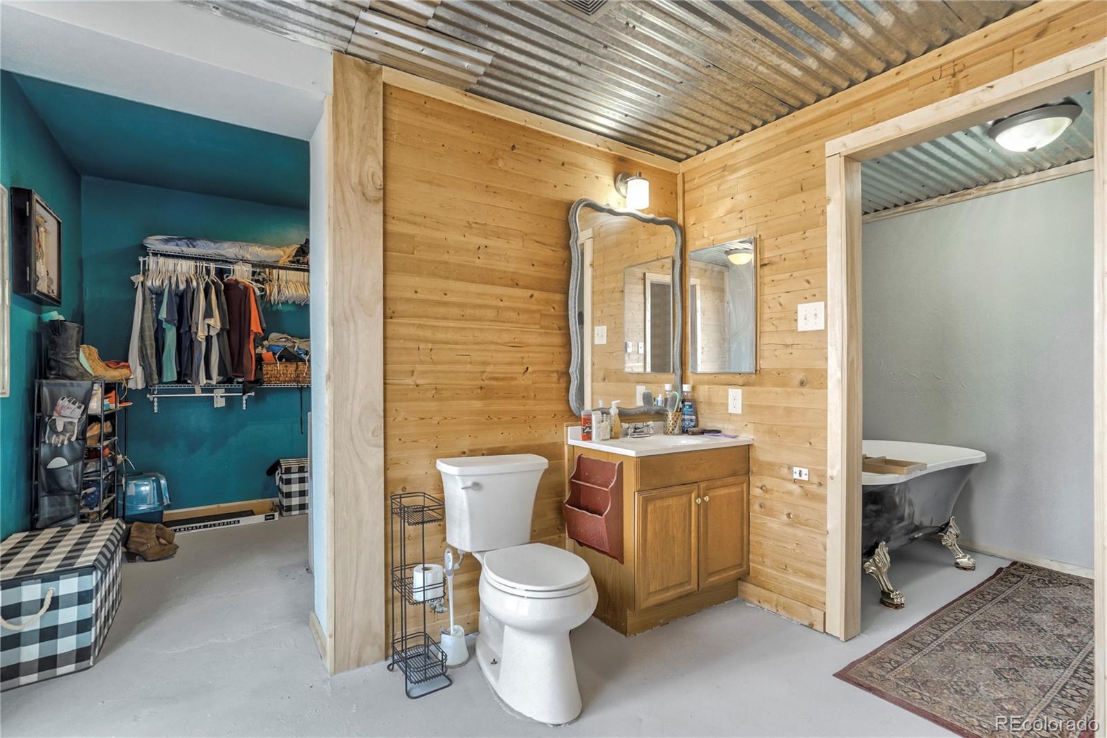 3549 County Road 650 Rye, CO 81069 - Photo 18 of 39 a bathroom with a toilet sink and mirror