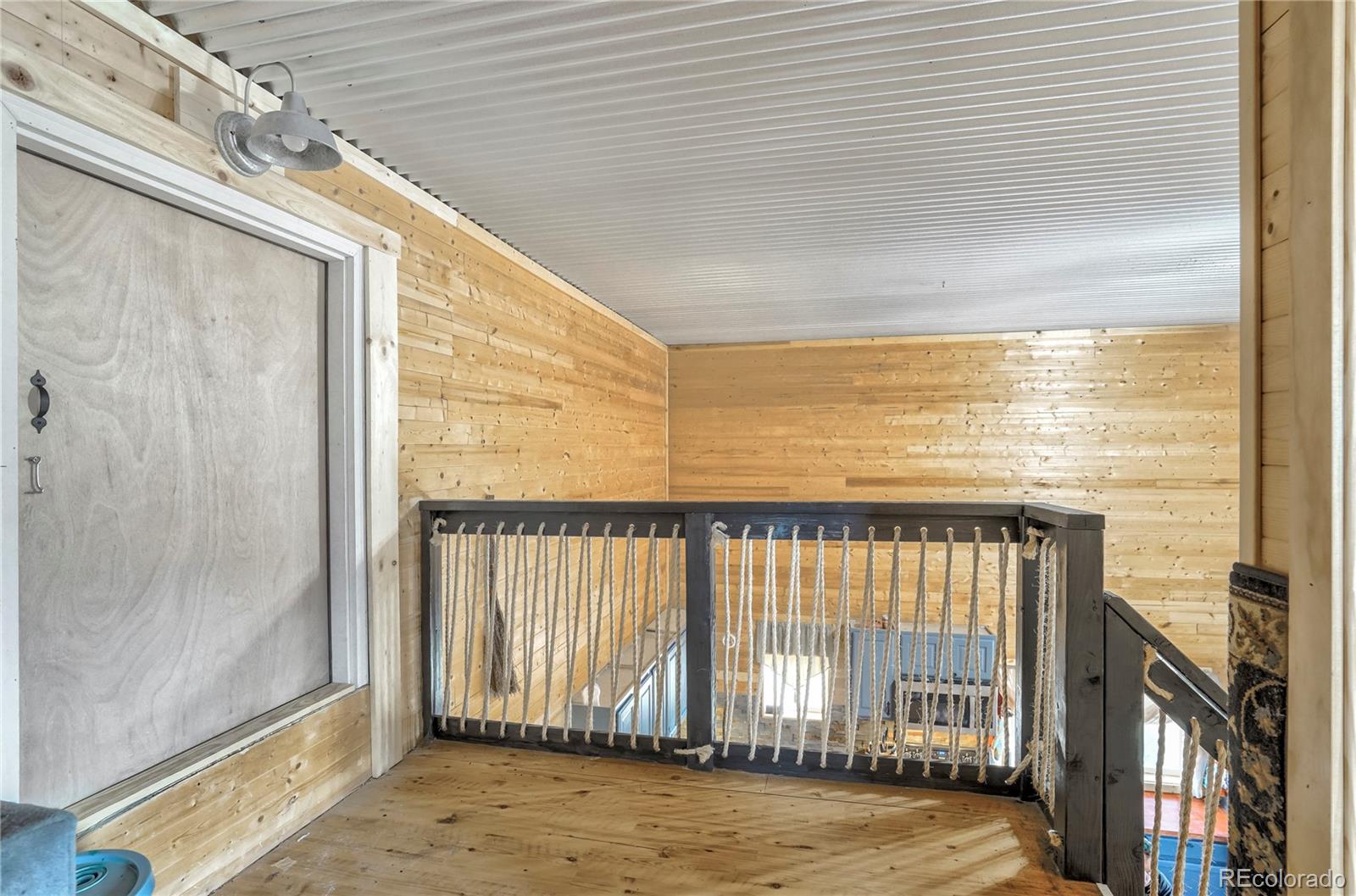 3549 County Road 650 Rye, CO 81069 - Photo 24 of 39 a view of a balcony with floor to ceiling window and stairs