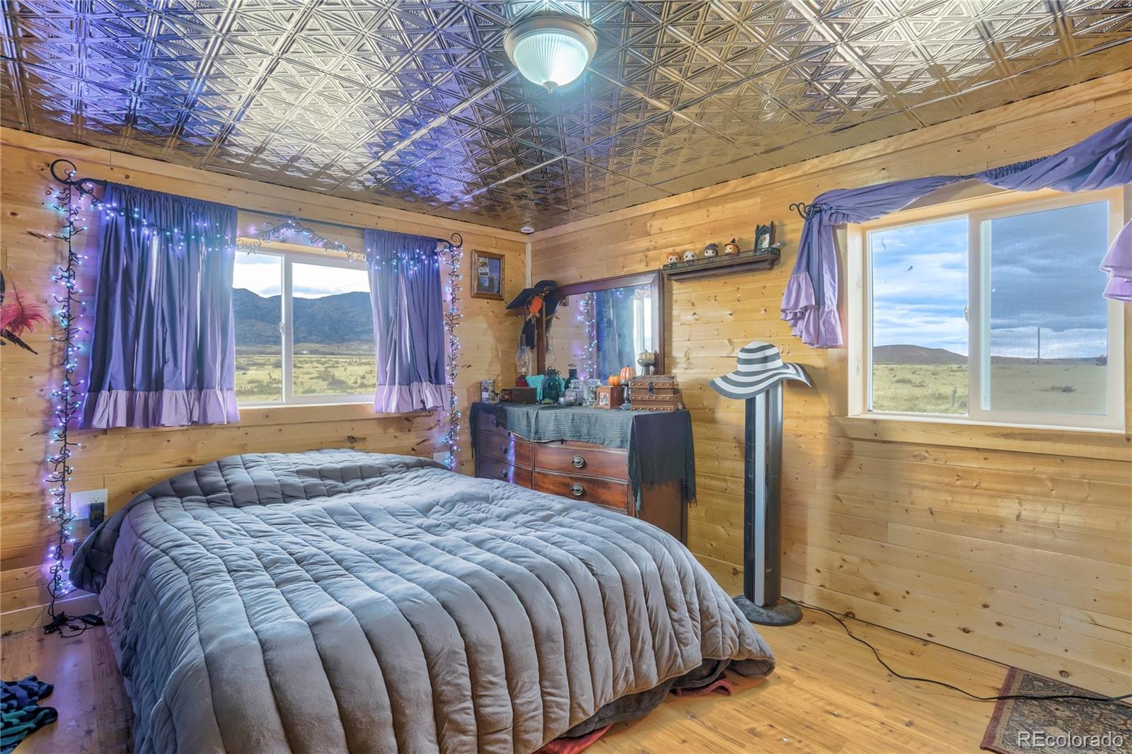 3549 County Road 650 Rye, CO 81069 - Photo 25 of 39 a bed sitting in a bedroom next to a window