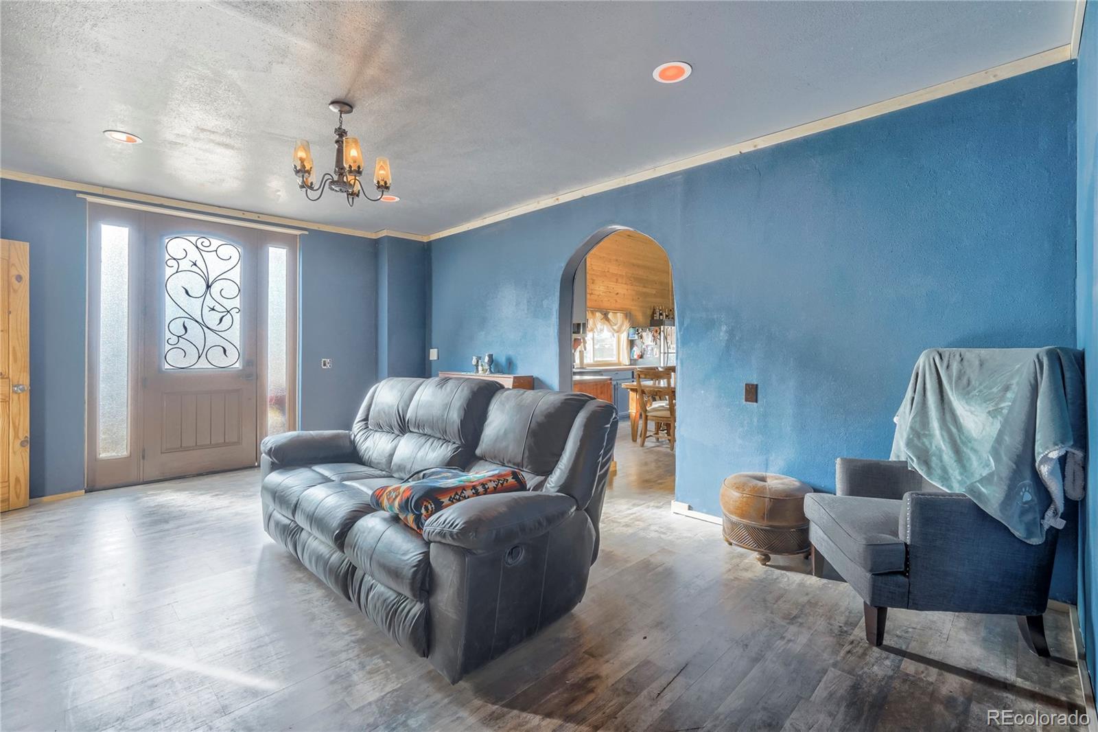 3549 County Road 650 Rye, CO 81069 - Photo 5 of 39 a living room with furniture and a chandelier