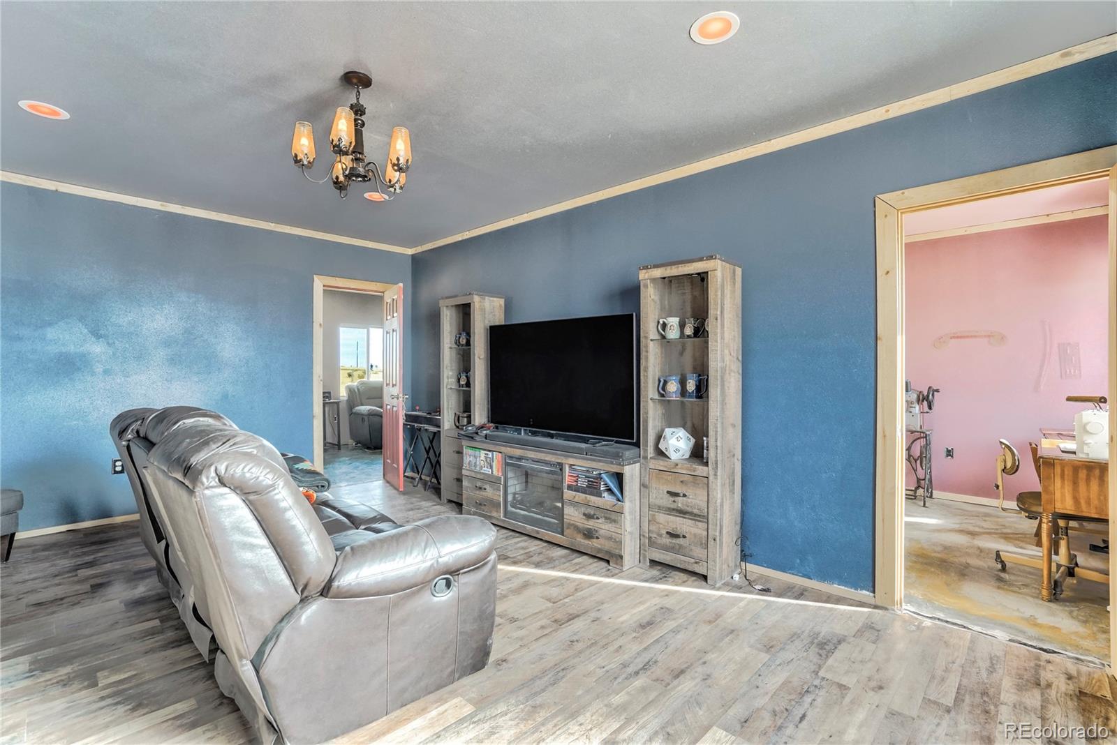 3549 County Road 650 Rye, CO 81069 - Photo 6 of 39 a living room with furniture and a flat screen tv