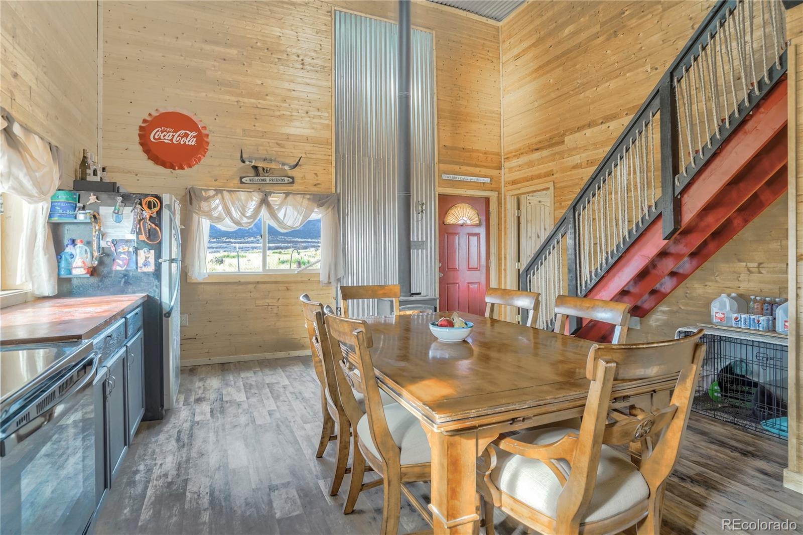 3549 County Road 650 Rye, CO 81069 - Photo 7 of 39 a view of a dining room with furniture front door and wooden floor