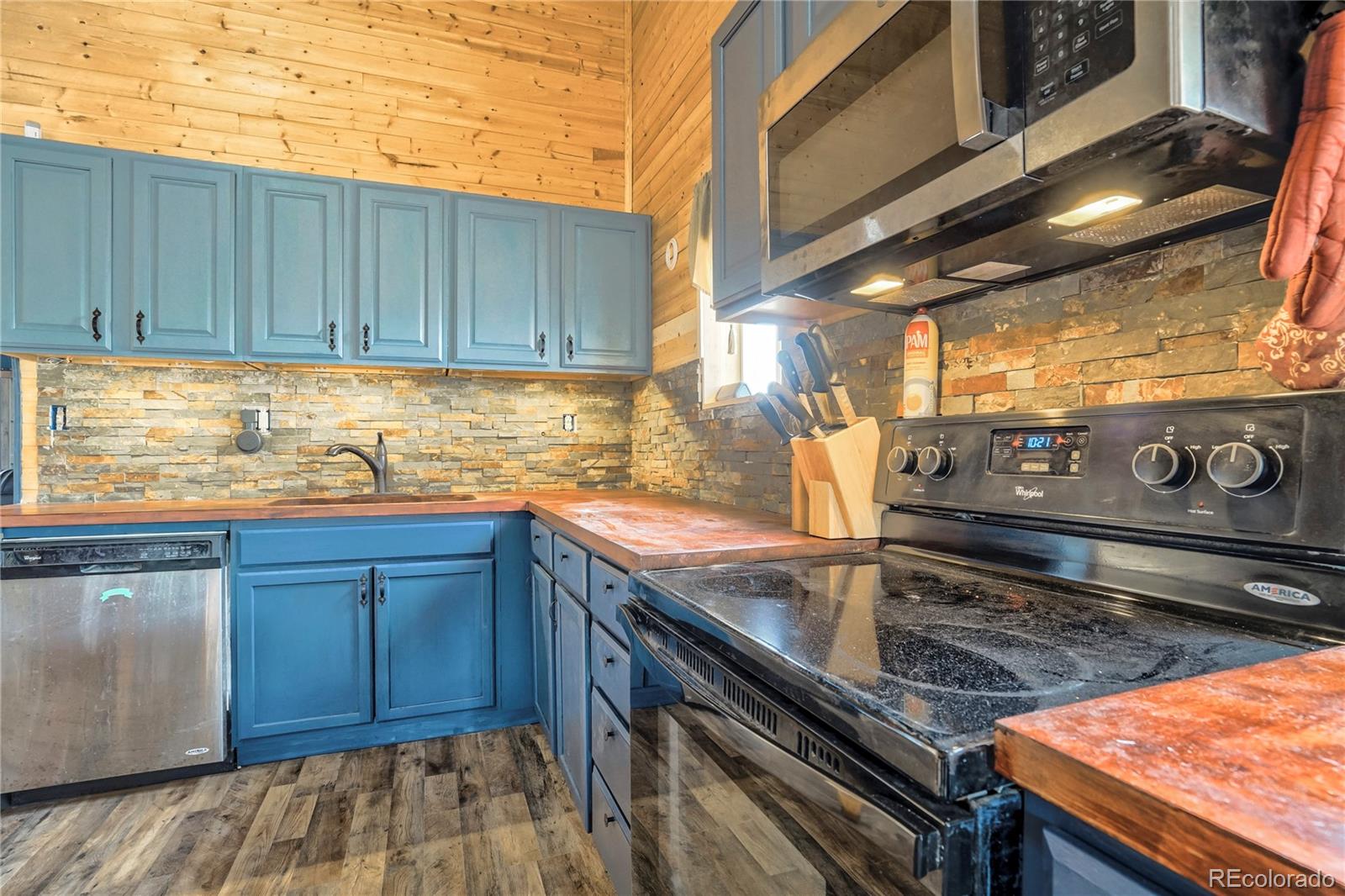 3549 County Road 650 Rye, CO 81069 - Photo 8 of 39 a kitchen with stainless steel appliances granite countertop wooden cabinets and a counter top space