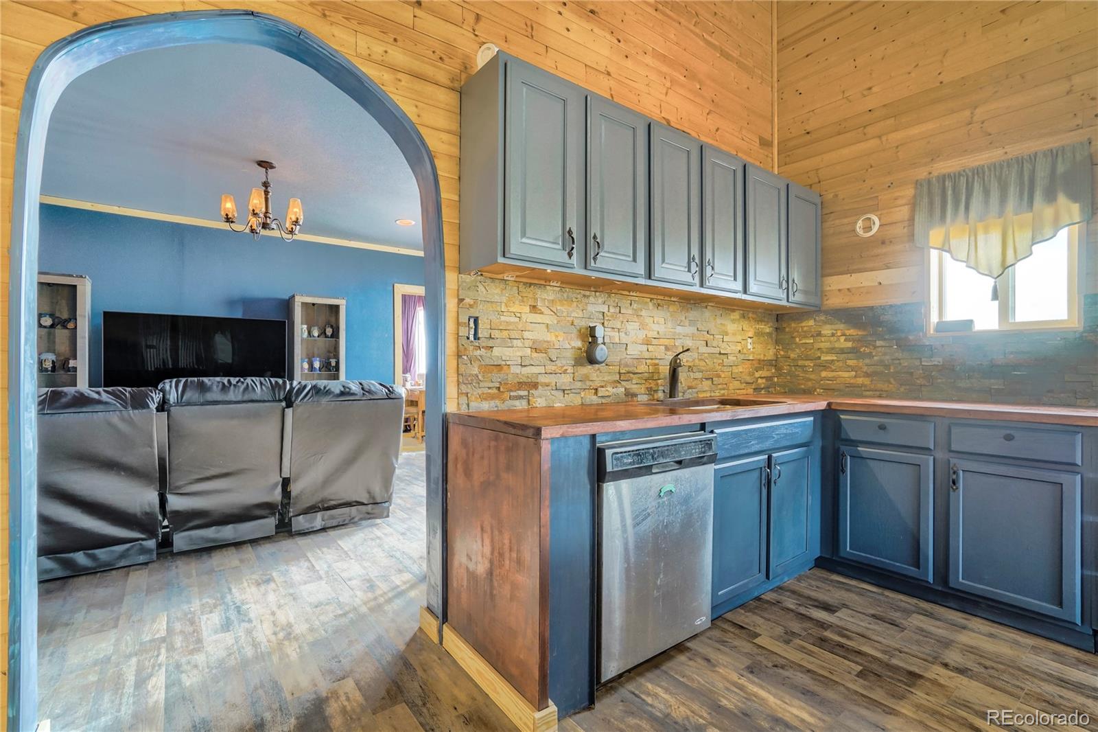3549 County Road 650 Rye, CO 81069 - Photo 9 of 39 a kitchen with stainless steel appliances granite countertop a sink a stove and cabinets