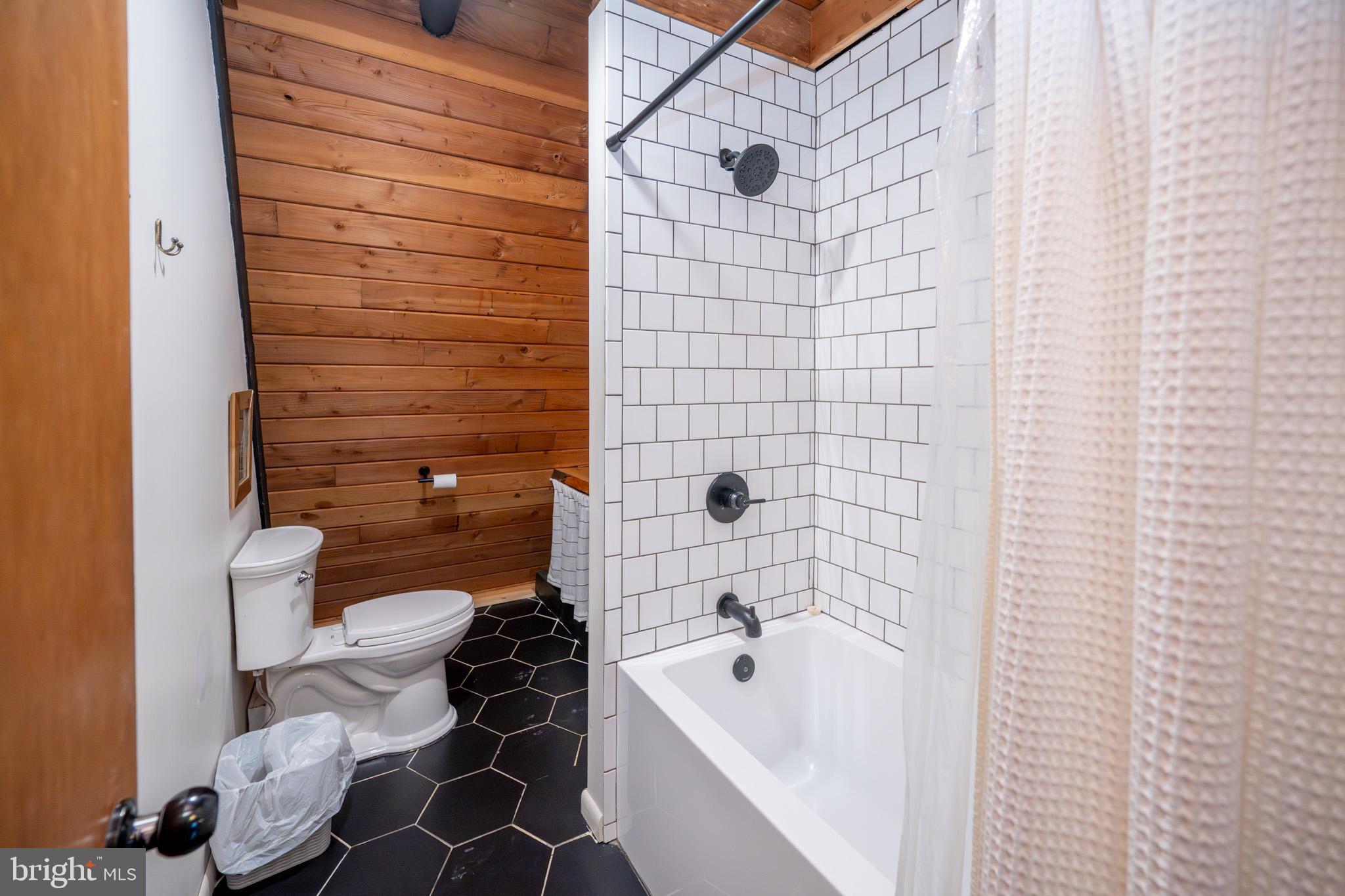 527 Deer Run Lane Swanton, MD 21561 - Photo 17 of 51 a bathroom with a sink and a bathtub