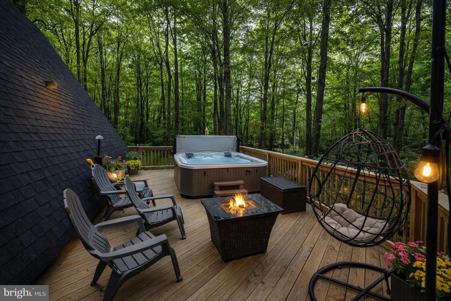 527 Deer Run Lane Swanton, MD 21561 - Photo 3 of 51 a view of a patio with table and chairs with wooden floor and fence