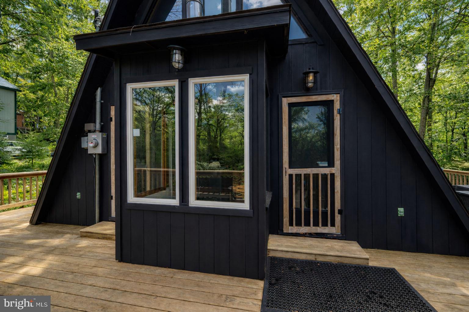 527 Deer Run Lane Swanton, MD 21561 - Photo 50 of 51 a view of a black house with a large window