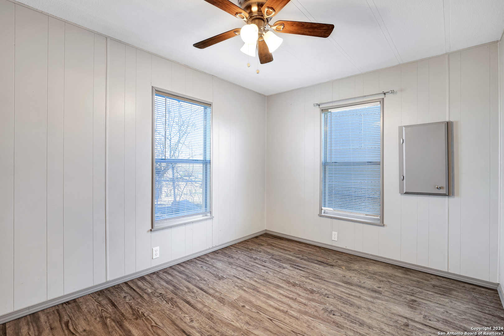 18066 La Gloria Road Elmendorf, TX 78112 - Photo 22 of 24 wooden floor in an empty room with a window
