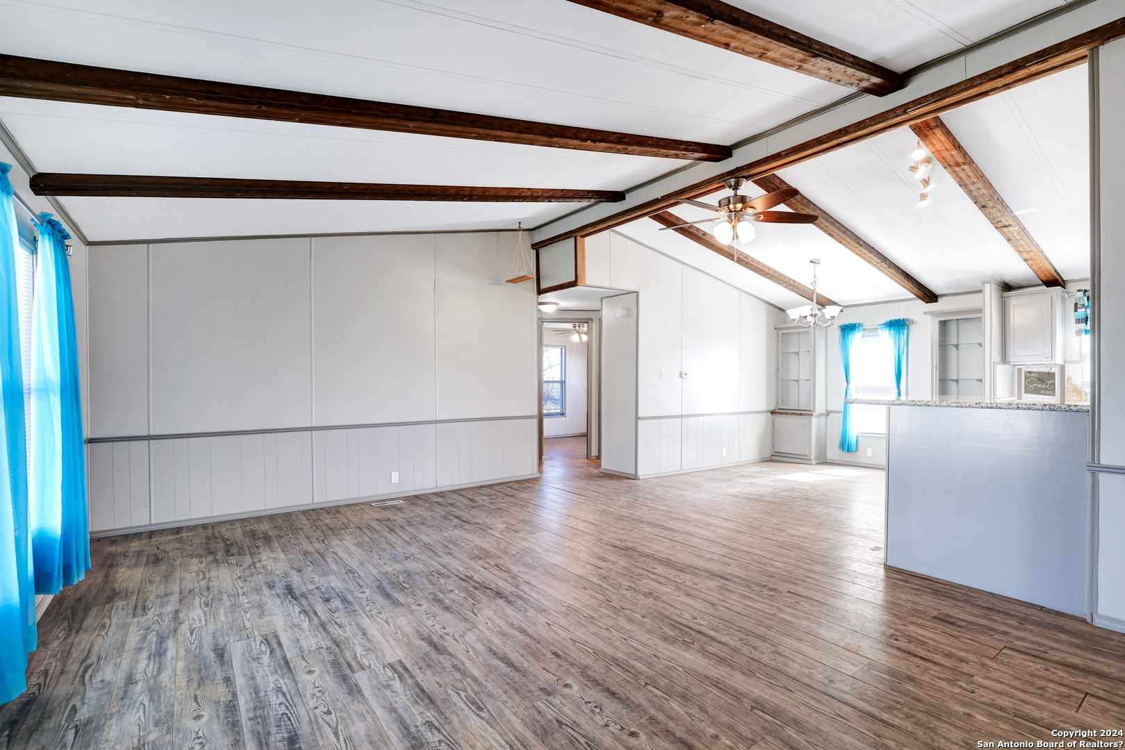 18066 La Gloria Road Elmendorf, TX 78112 - Photo 4 of 24 a view of empty room with wooden floor