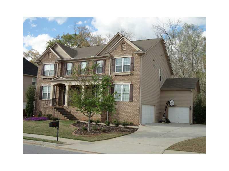 3264 Walnut Ridge Atlanta, GA 30349 - Photo 1 of 1 Exterior Front. Level yard with 3-Car Garage.