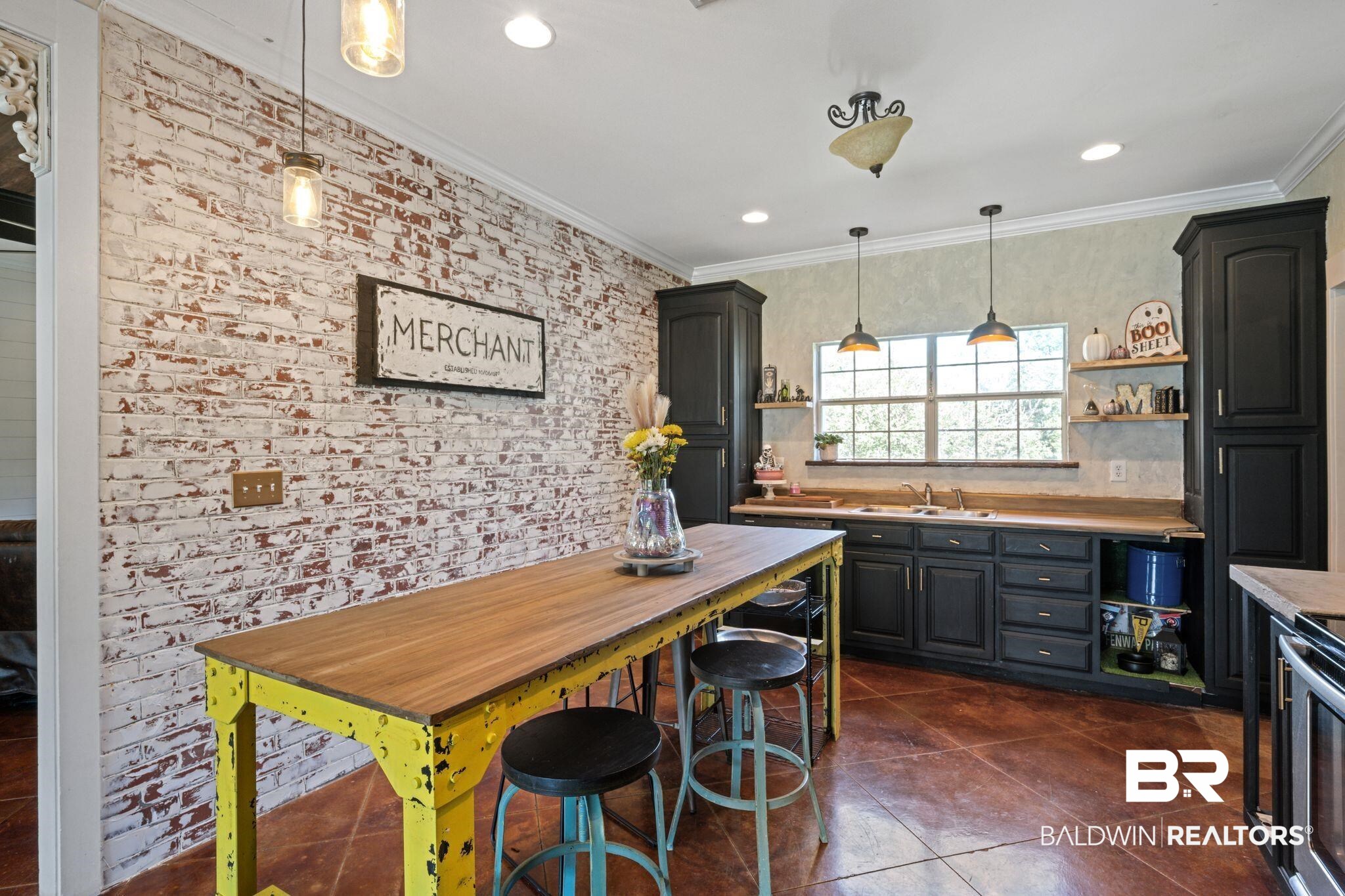 15635 North A N Brady Road Bay Minette, AL 36507 - Photo 16 of 51 Kitchen featuring sink, hanging light fixtures, ornamental molding, and dark tile patterned floors