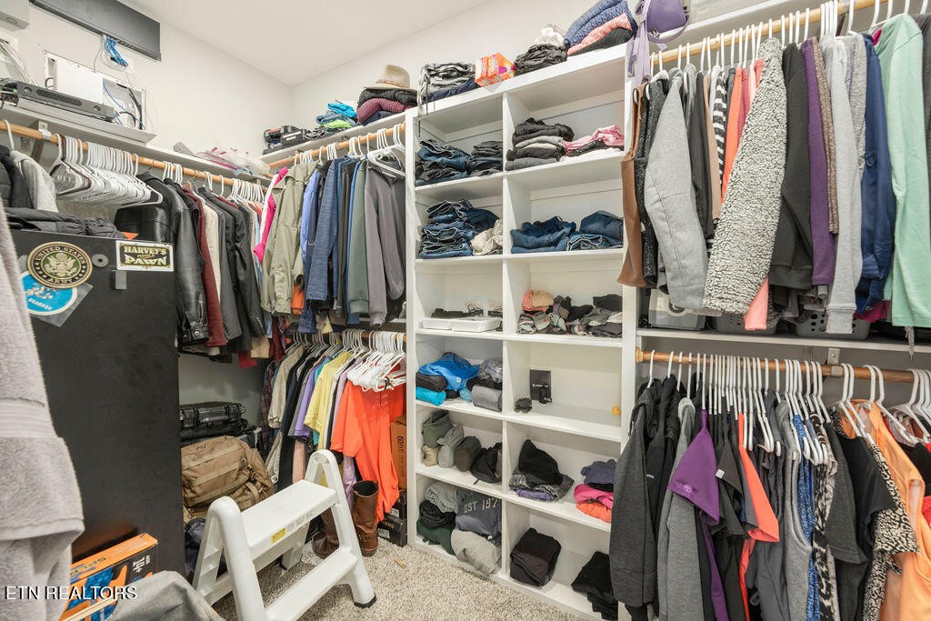 9760 Chestnut Ridge Road Heiskell, TN 37754 - Photo 22 of 59 a view of walk in closet with clothes and shoes