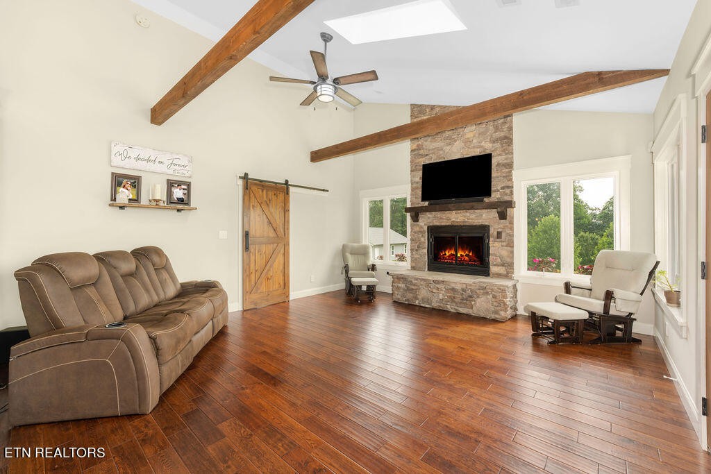 9760 Chestnut Ridge Road Heiskell, TN 37754 - Photo 3 of 59 a living room with furniture fireplace and a flat screen tv