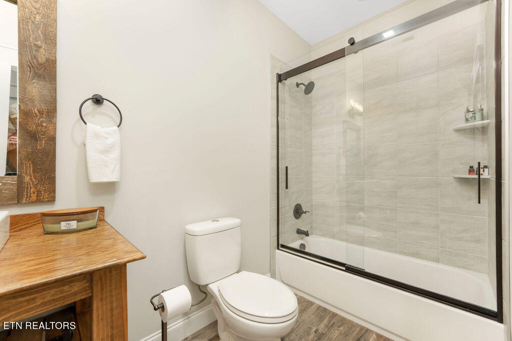 9760 Chestnut Ridge Road Heiskell, TN 37754 - Photo 32 of 59 a bathroom with a shower a toilet and a sink
