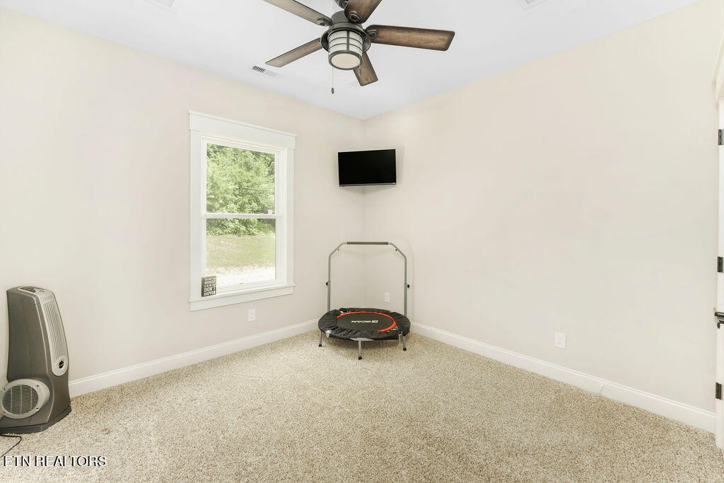 9760 Chestnut Ridge Road Heiskell, TN 37754 - Photo 33 of 59 a living room with a couch