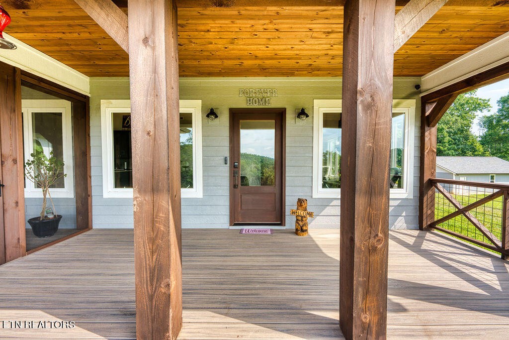 9760 Chestnut Ridge Road Heiskell, TN 37754 - Photo 36 of 59 a front view of a house with a porch