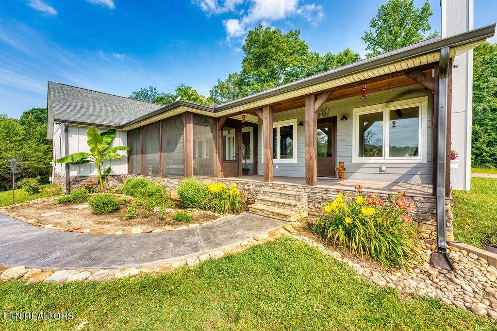 9760 Chestnut Ridge Road Heiskell, TN 37754 - Photo 39 of 59 a view of a house with a yard