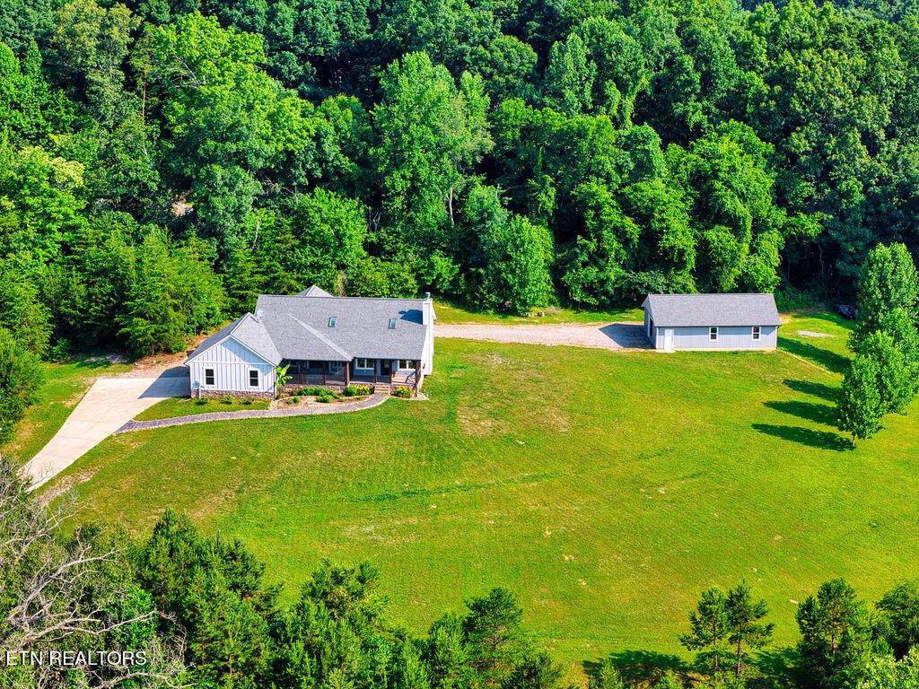 9760 Chestnut Ridge Road Heiskell, TN 37754 - Photo 49 of 59 a view of a house with a yard