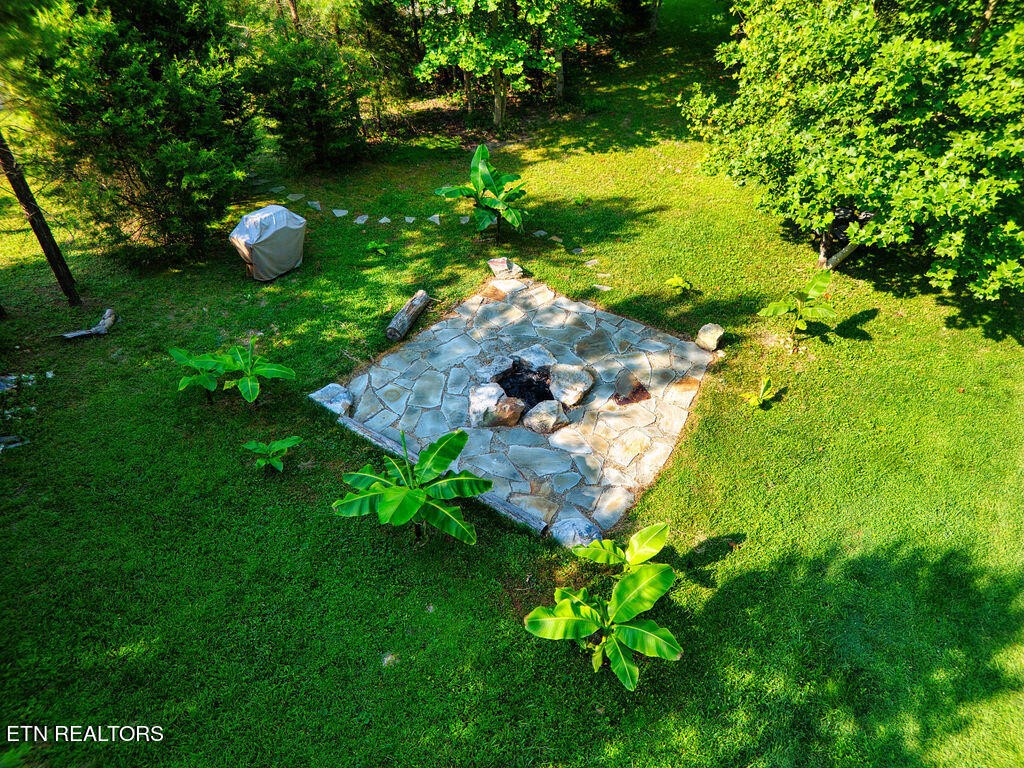 9760 Chestnut Ridge Road Heiskell, TN 37754 - Photo 51 of 59 a backyard of a house with lots of green space
