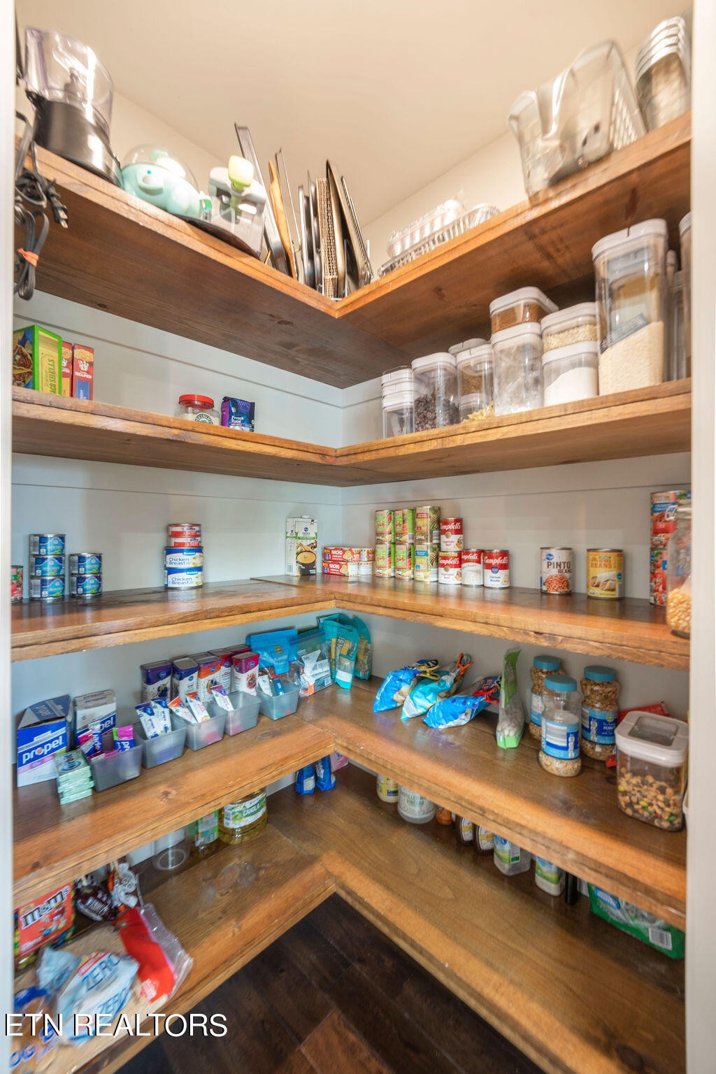 9760 Chestnut Ridge Road Heiskell, TN 37754 - Photo 8 of 59 a store room with granite countertop lots of different kinds of food