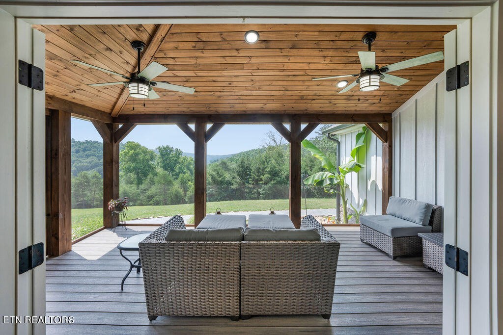 9760 Chestnut Ridge Road Heiskell, TN 37754 - Photo 9 of 59 a living room with a table and chairs