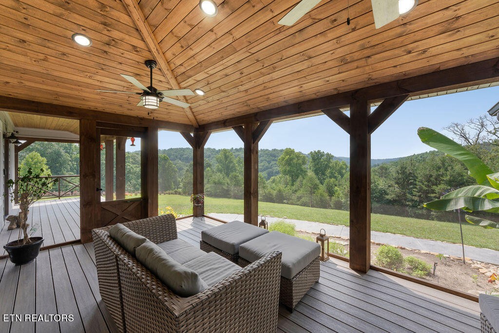 9760 Chestnut Ridge Road Heiskell, TN 37754 - Photo 10 of 59 a living room with patio furniture and a floor to ceiling window