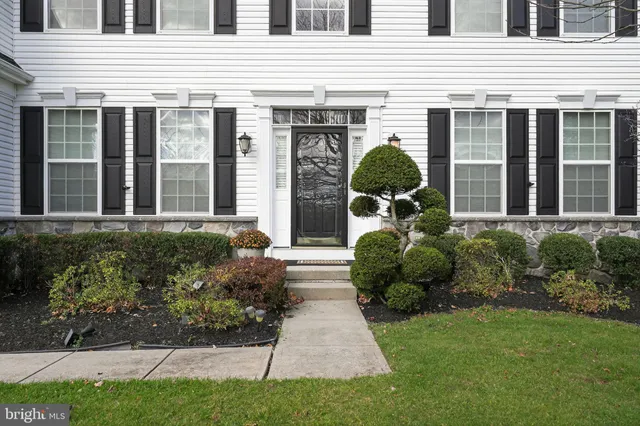 a view of a lake with couches in the patio