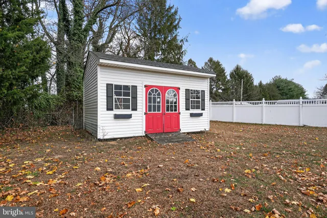 a living room with fireplace furniture and a flat screen tv