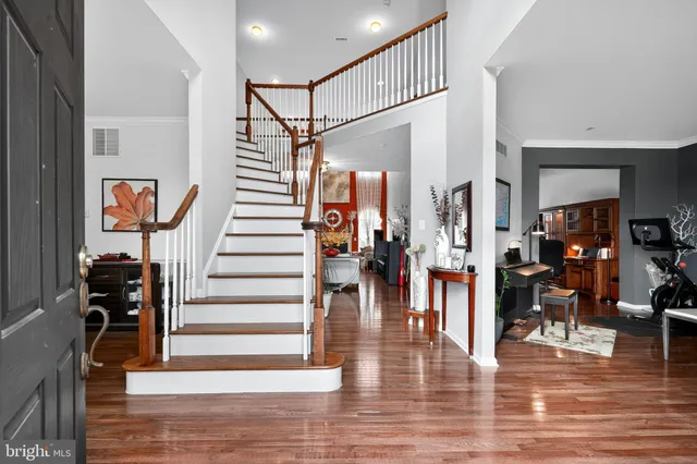 a living room with furniture or couch and a wooden floor