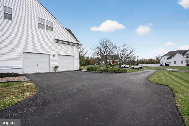 a view of a house with a yard and garage