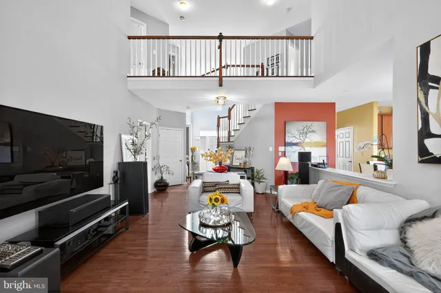 a view of a dining room with furniture wooden floor and chandelier