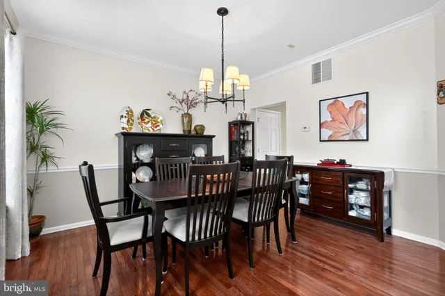 a view of walk in closet with clothes