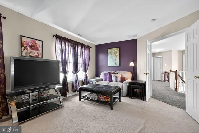 an aerial view of a house with outdoor space and lake view