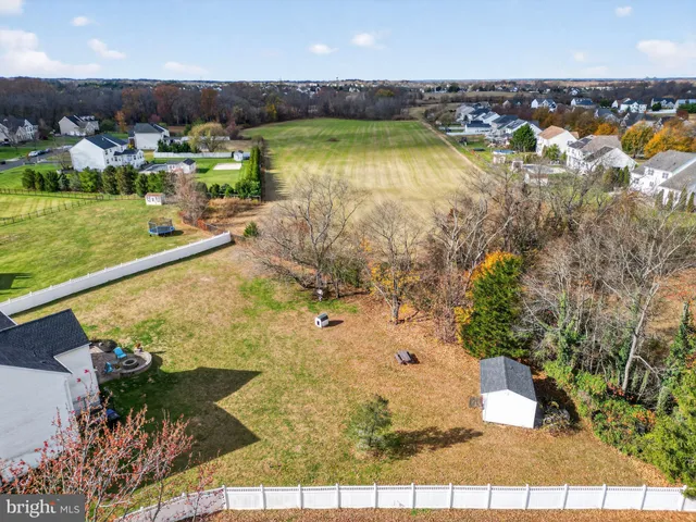 an aerial view of a house with a ocean view