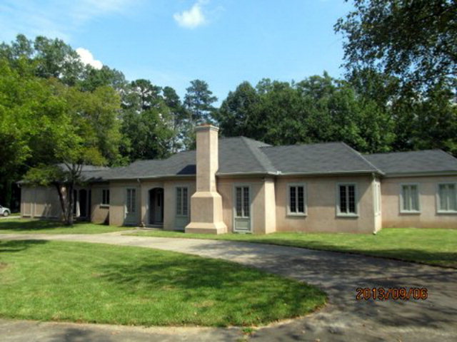 5150 Zebulon Road Macon, GA 31210 - Photo 1 of 33 a front view of a house with a yard